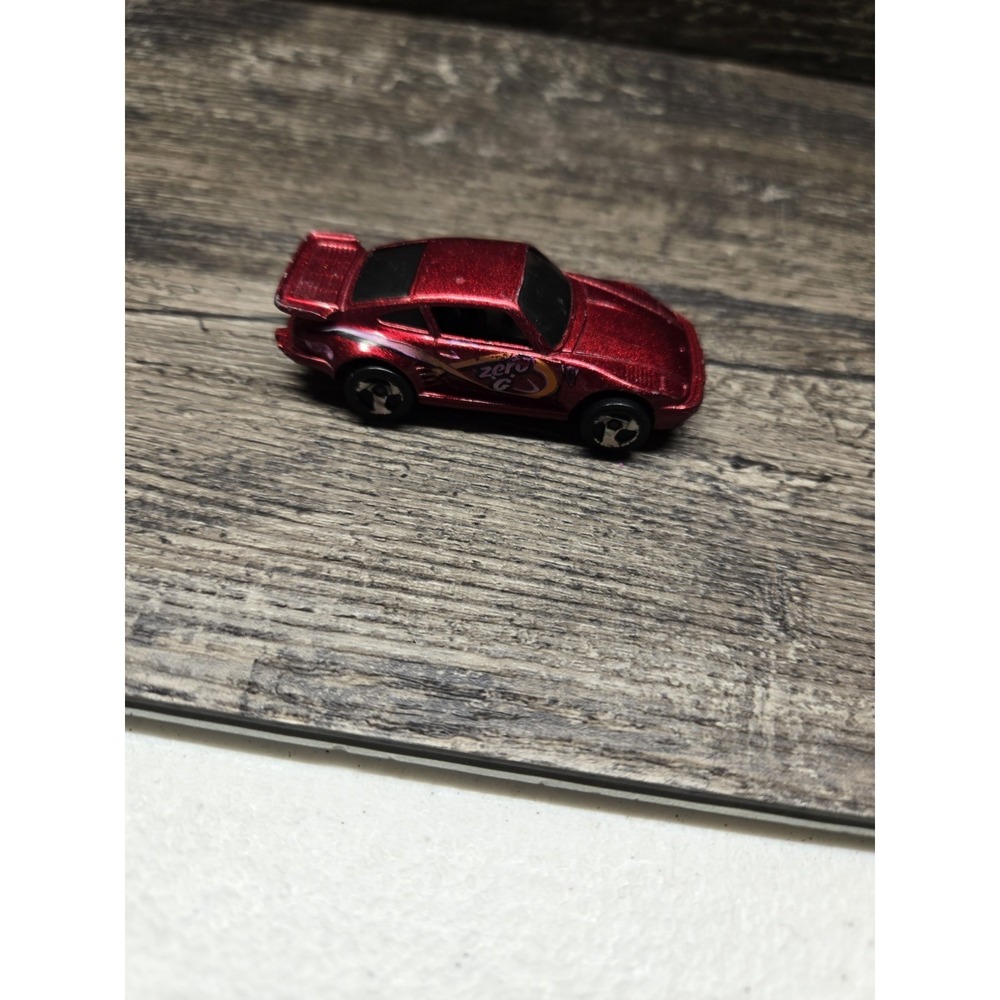 1989 HOT WHEELS PORSCHE 930 ZERO G RED 1:64 DIECAST 2 3/4" CAR W/ ORANGE SWIRLS